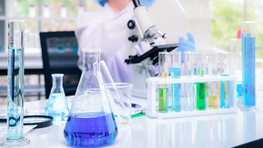 Why Is There a Class Action Lawsuit Against Beyond Meat’s Plant-Based Protein Claims? 1 Glass beakers and test tubes with blue and green liquids in a lab